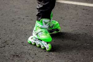 Close up of bright green inlines being worn by a child