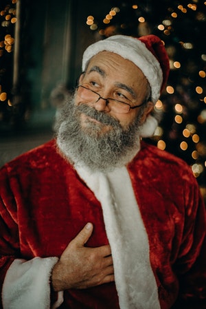 Man dressed as Santa Claus looking pleased with himself